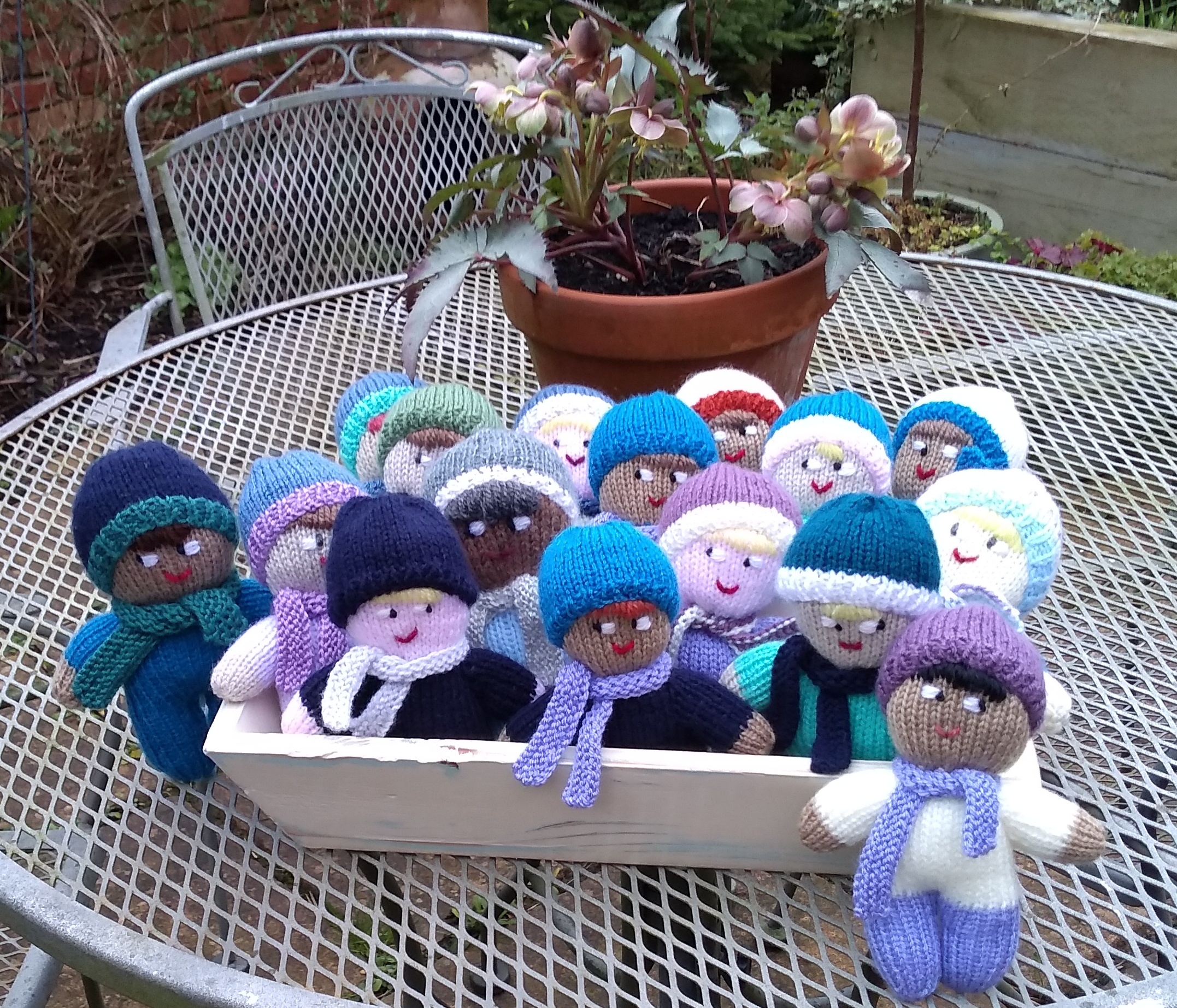 A box of knitted mascots.