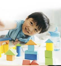 A child plays with building bricks.