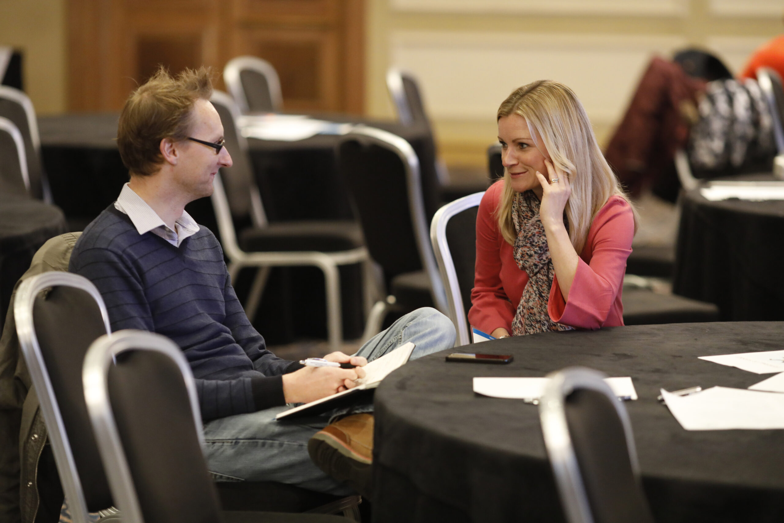 adults chatting at a conference