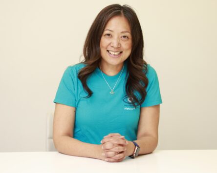 Karen Chu wearing a blue Nystagmus Network T-shirt.